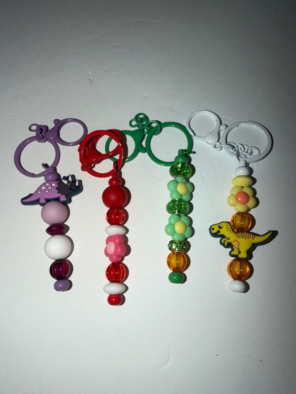 Purple, Red, Green and White Kids Dinosaur Bead Keychain Set